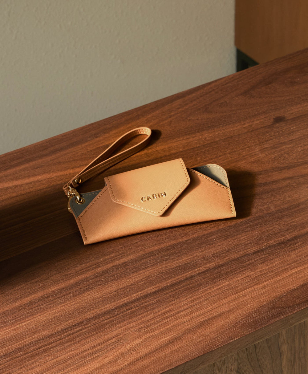 CARIN leather case on a wooden table