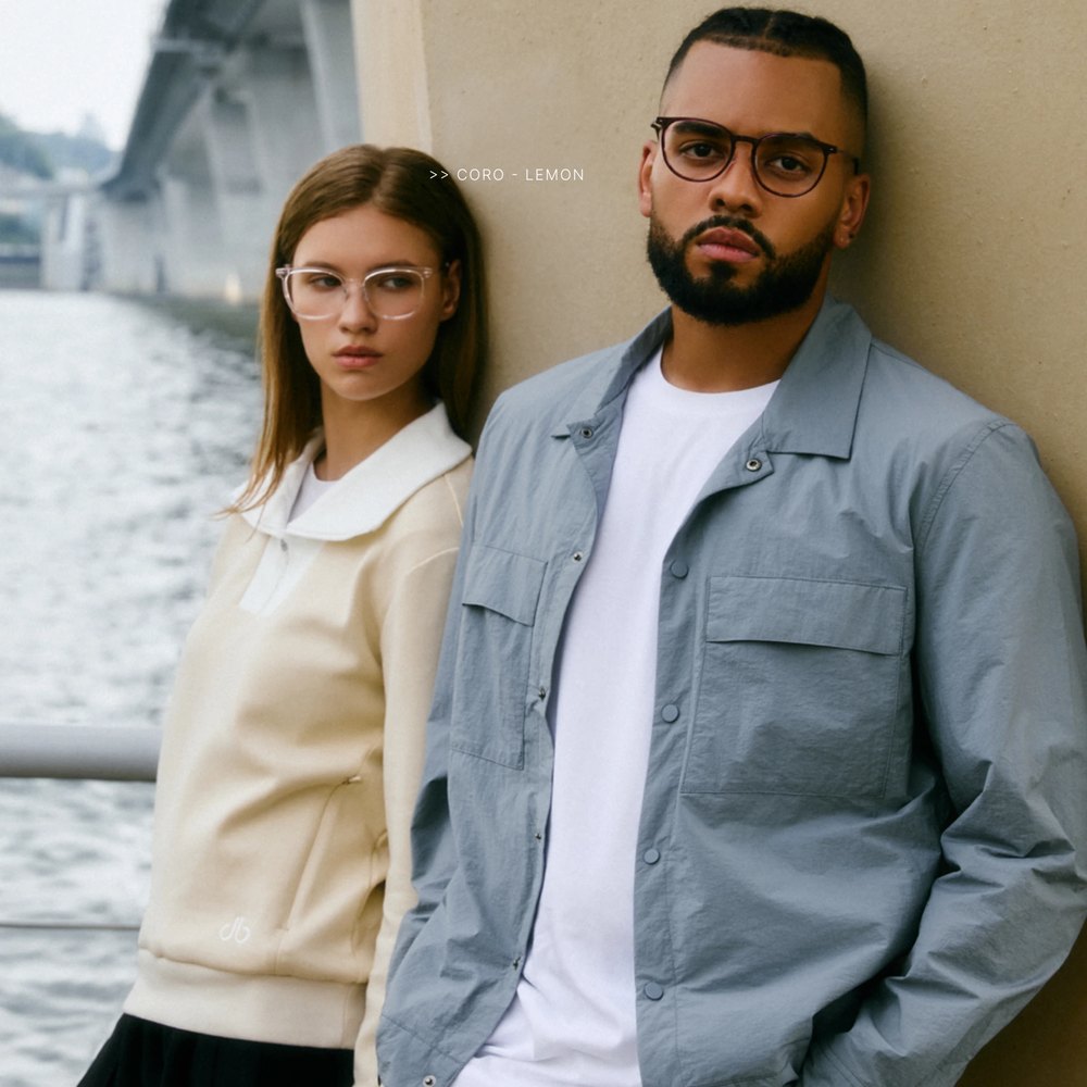 Man and woman in VYCOZ glasses beside a river