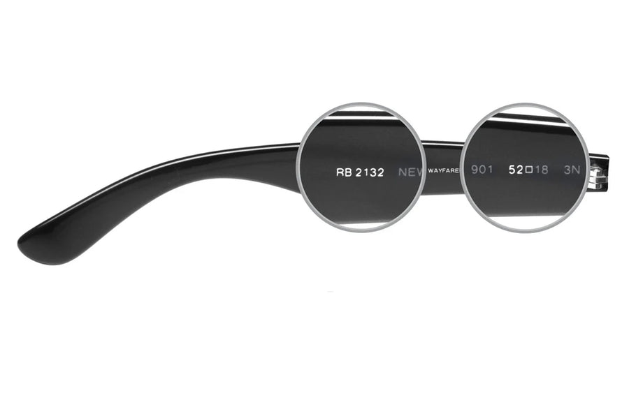 Folded Ray-Ban frames showing the model code and lens width printed inside the temple arm