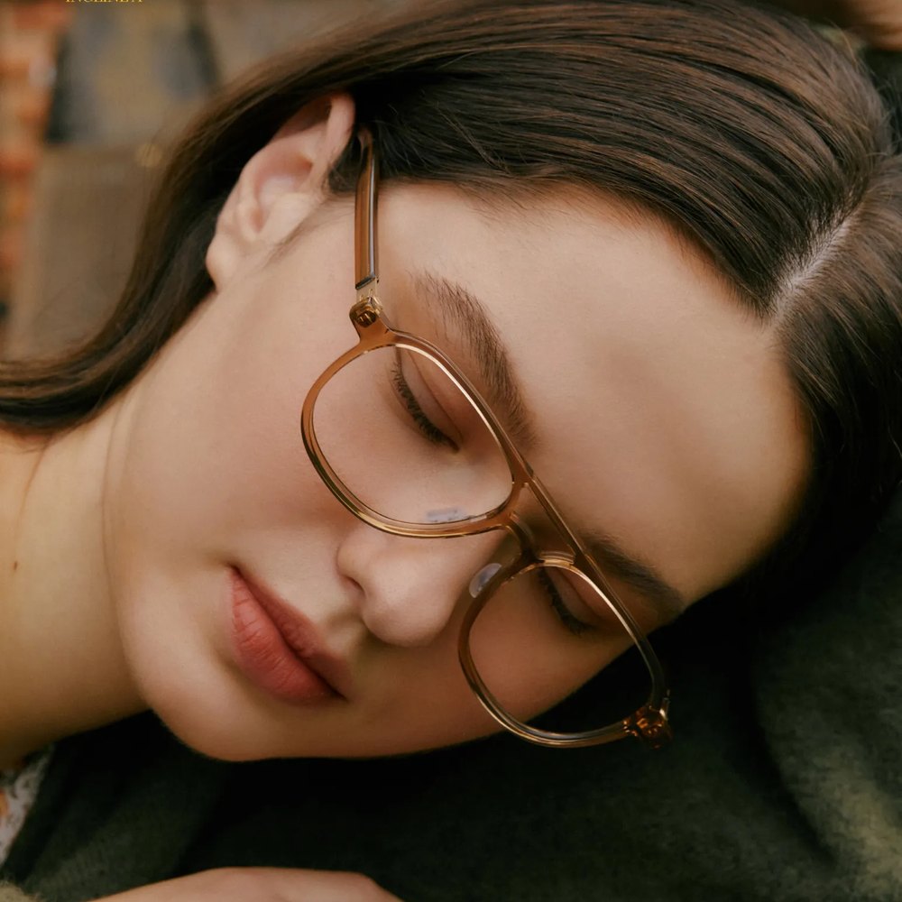 Woman resting in VYCOZ tortoise glasses