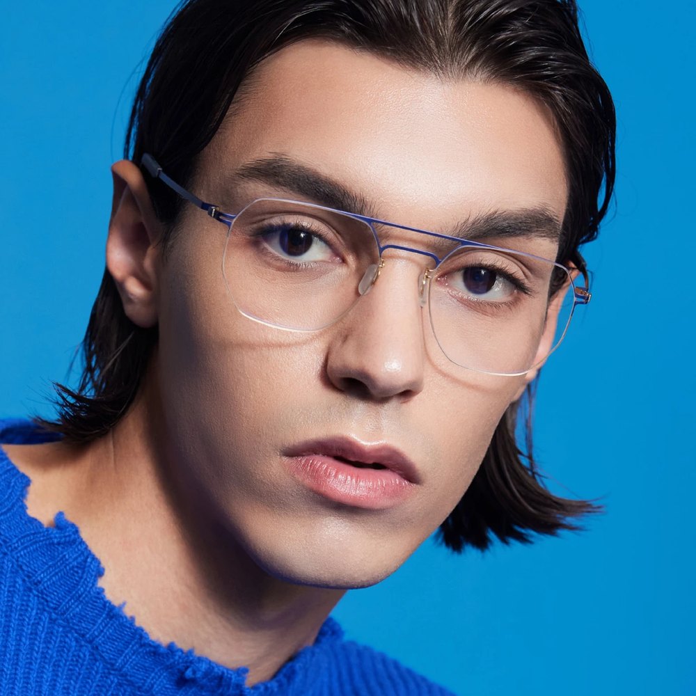 Man in VYCOZ glasses and a cobalt sweater