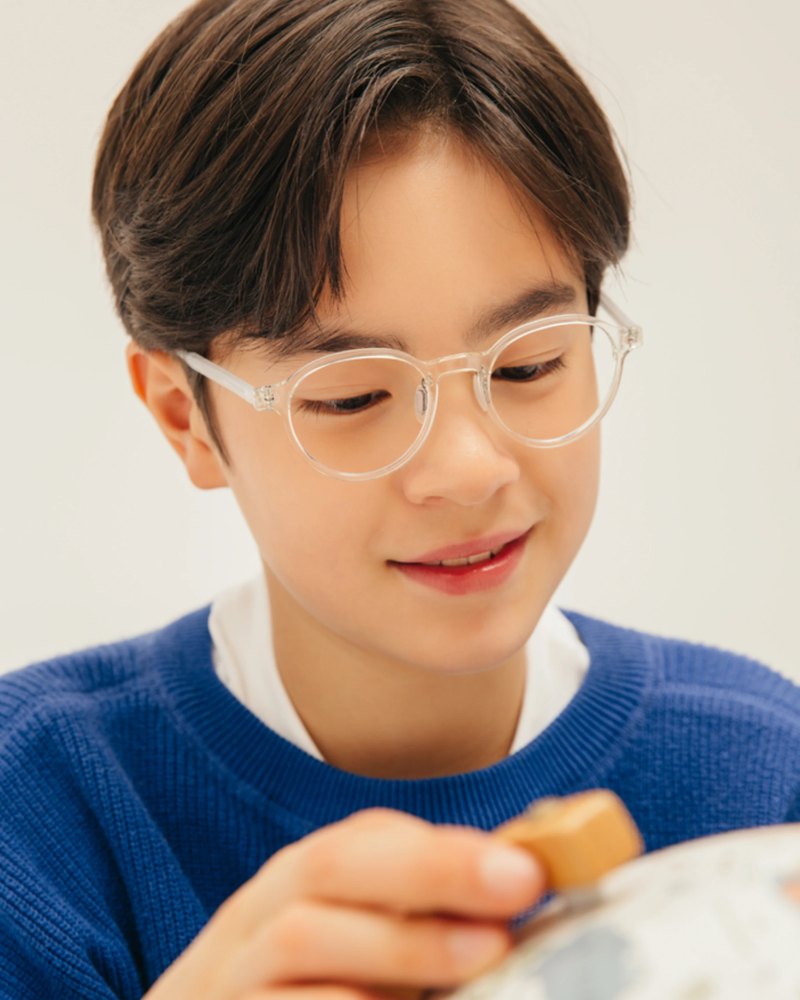 Boy in VYCOZ kids glasses and a blue sweater