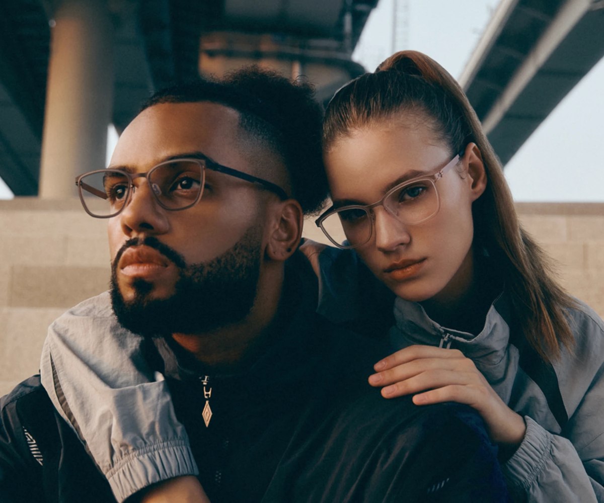 Man and woman in VYCOZ glasses under a Han River bridge in Seoul